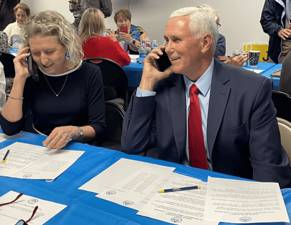 Republican Virginia Congressional District 2 candidate Jen Kiggans and former Vice President Mike Pence make phone calls Nov. 2 in Virginia Beach, Va., on Nov. 2, lobbying for votes in her campaign to unseat Rep. Elaine Luria (D-Va.) in one the nation’s tightest “tossup” congressional races. (Courtesy Jen Kiggans for Congress)