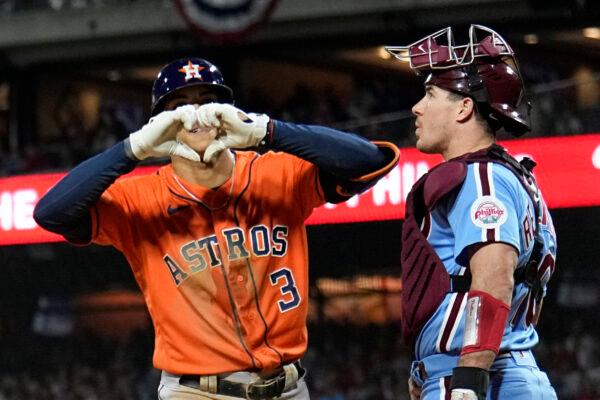 Houston Astros' Jeremy Pena celebrates his home run past Philadelphia Phillies catcher J.T. Realmuto during the fourth inning in Game 5 of baseball's World Series between the Houston Astros and the Philadelphia Phillies in Philadelphia, on Nov. 3, 2022. (Matt Slocum/AP Photo)