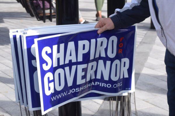 Supporters take yard signs at Lancaster, Pa. rally for Democrat candidate for governor, Josh Shapiro, Nov. 4, 2022. (Beth Brelje/The Epoch Times)