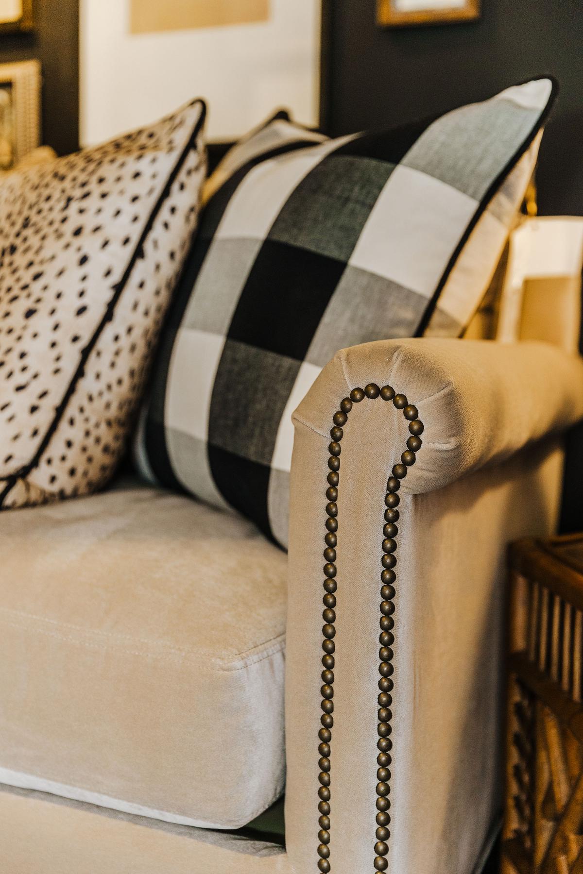 A hammered nail detail adds a sophisticated flair to this velvet sofa. (Handout/TNS)