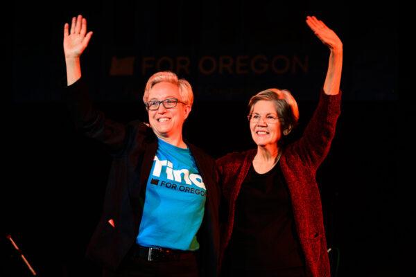 Sen. Elizabeth Warren (D-Mass.) (R) joins Democratic gubernatorial Candidate Tina Kotek on stage during a rally on October 22, 2022 in Portland, Oregon. (Mathieu Lewis-Rolland/Getty Images)
