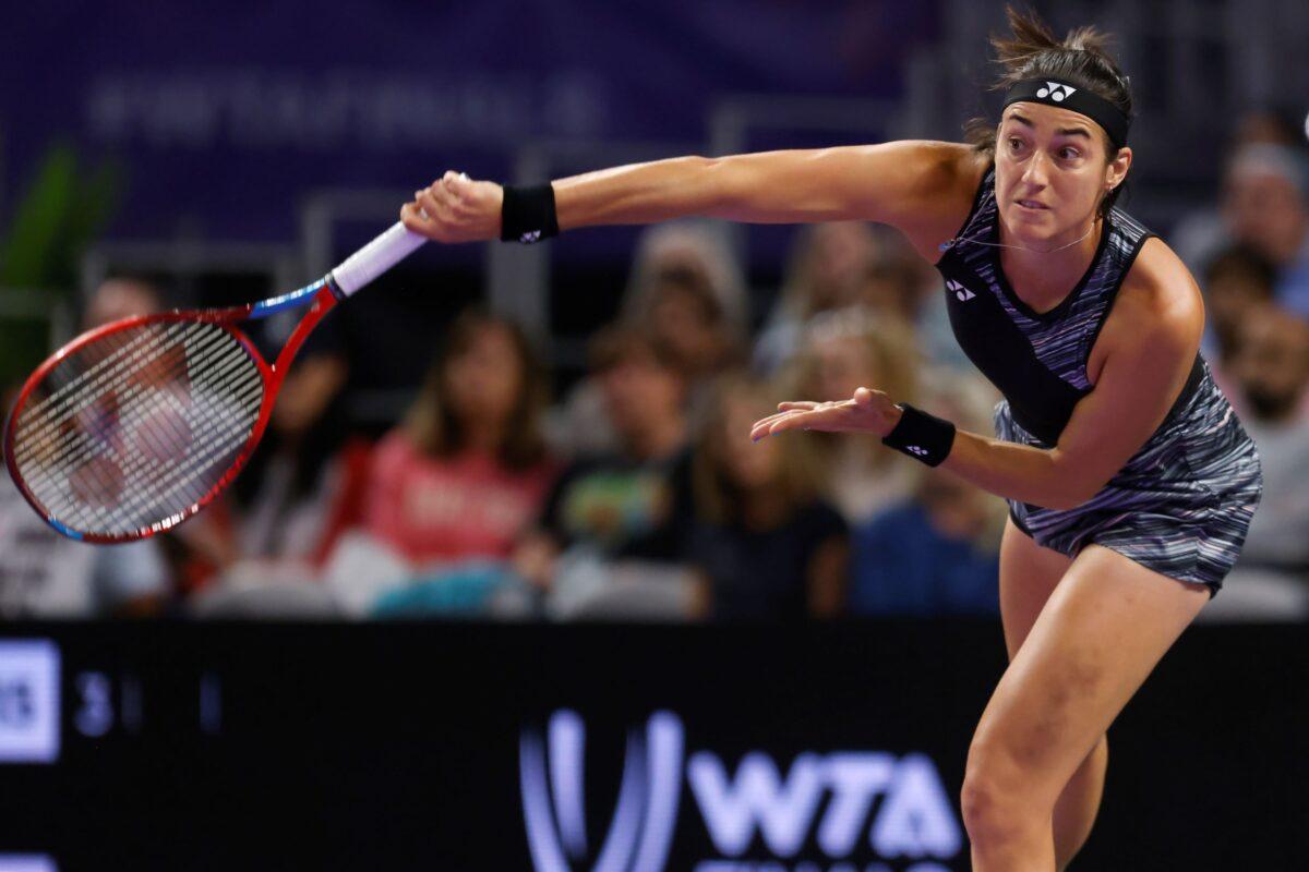 Caroline Garcia of France follows through on a serve to Maria Sakkari of Greece in the singles semifinals of the WTA Finals tennis tournament in Fort Worth, Texas, on Nov. 6, 2022. (Ron Jenkins/AP Photo)