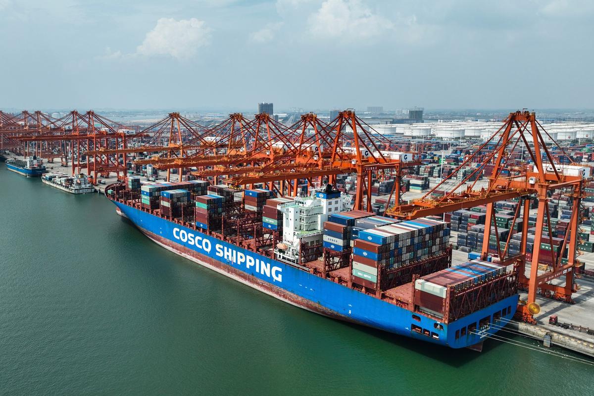 An aerial view shows a container ship berthed at the container wharf of Qinzhou Port in Qinzhou in southern China's Guangxi Zhuang Autonomous Region on Sept. 13, 2022. (Zhang Ailin/Xinhua via AP)