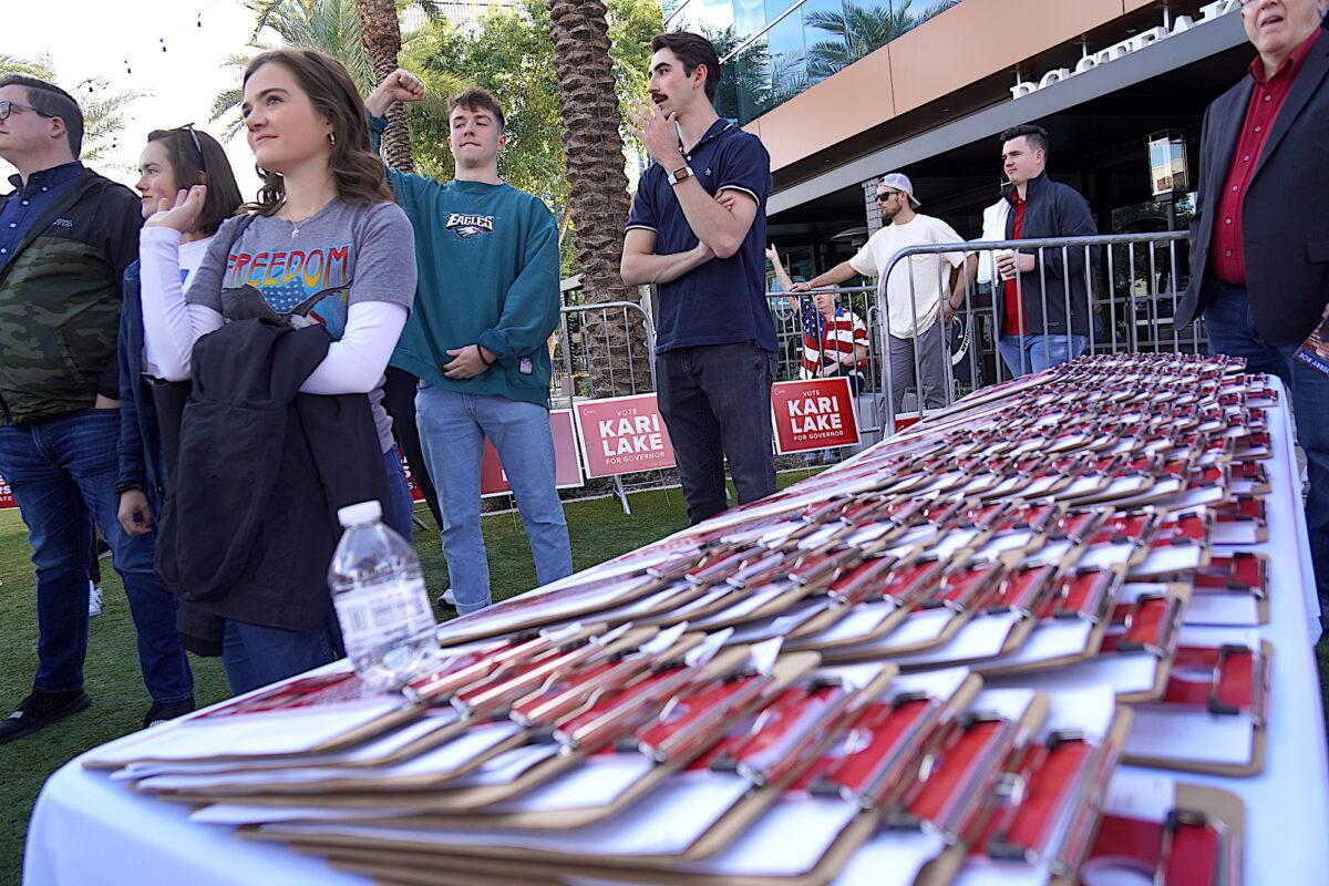 Republican volunteers listen to a slate of speakers at an "Arizona Freedom Fest" rally in Chandler, Ariz., on Nov. 7, before they went knocking on doors to get out the vote in the midterm election. (Allan Stein/The Epoch Times)