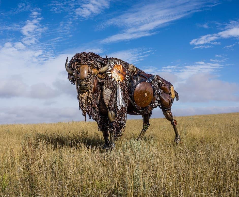 A scrap metal bison in a landscape. (Courtesy of <a href="https://www.instagram.com/johnlopezstudio/">John Lopez</a>)