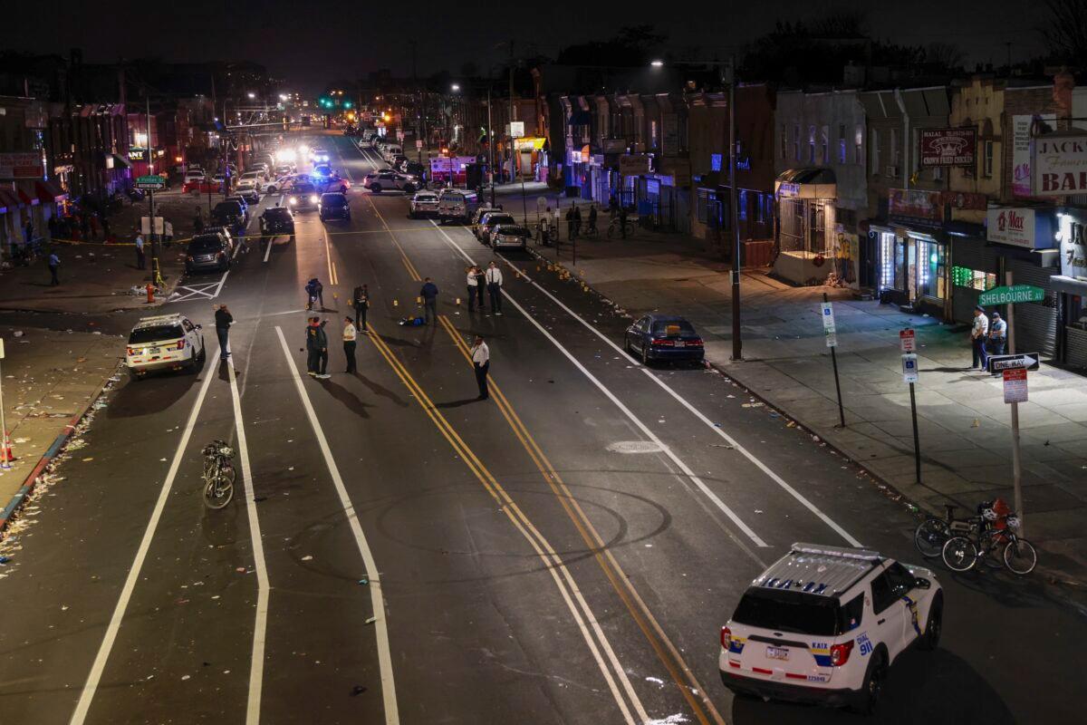 Philadelphia police process part of a crime scene where multiple people were injured in a shooting in Philadelphia late on Nov. 5, 2022. (Elizabeth Robertson/The Philadelphia Inquirer via AP)