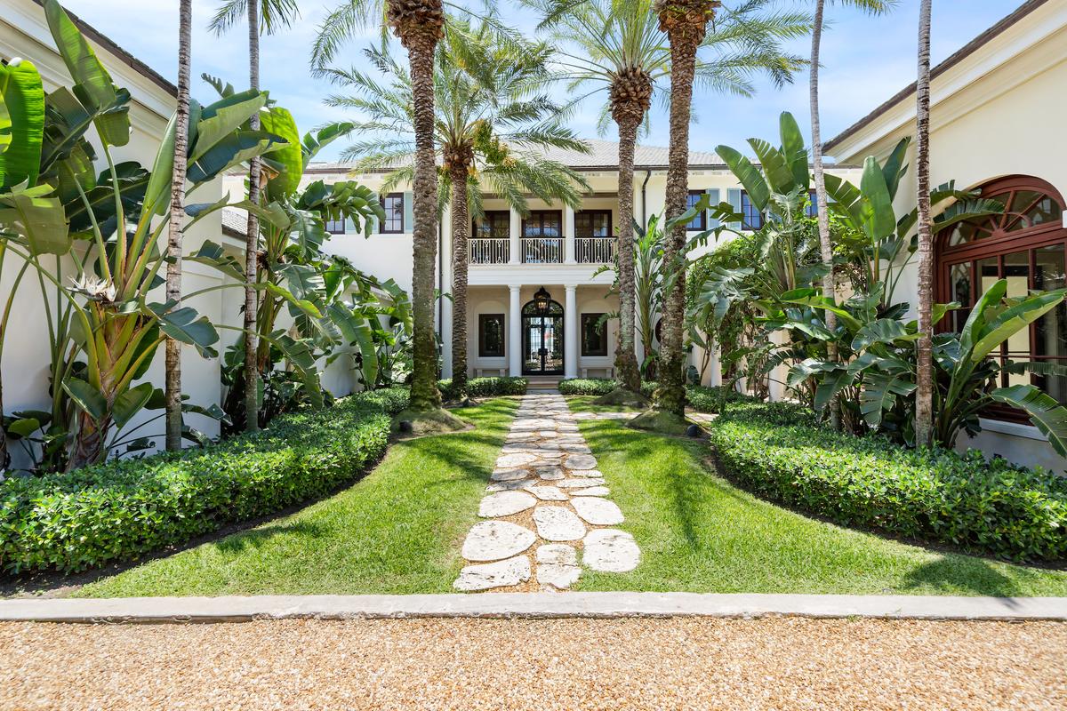 The property has impressive curb appeal, with a beautifully-landscaped entry. (Courtesy of Damianos Sotheby’s International Realty)