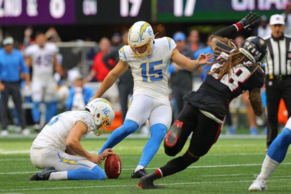 Cameron Dicker (15) of the Los Angeles Chargers kicks the game winning field goal during the fourth quarter in the game against the Atlanta Falcons at Mercedes-Benz Stadium in Atlanta, on Nov. 6, 2022. (Todd Kirkland/Getty Images)