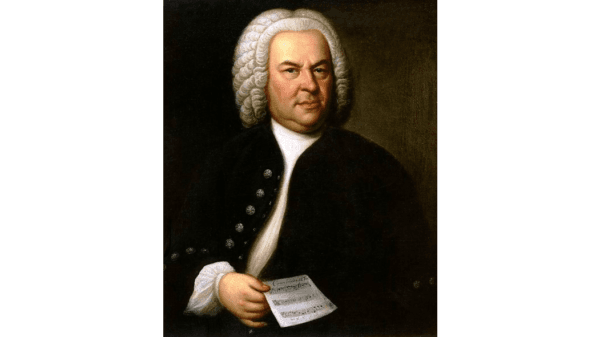 Baroque composer Johann Sebastian Bach, 1746, by Elias Gotlob Houssmann. The figure is shown holding holding the manuscript to BWV 1076, which is also the thirteenth canon in the Goldberg Canon cycle. (Public Domain)