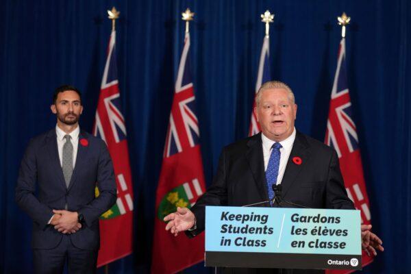 Ontario Premier Doug speaks during a press conference, as Education Minister Stephen Lecce looks on, at Queen's Park in Toronto on Nov. 7, 2022. (The Canadian Press/Nathan Denette)