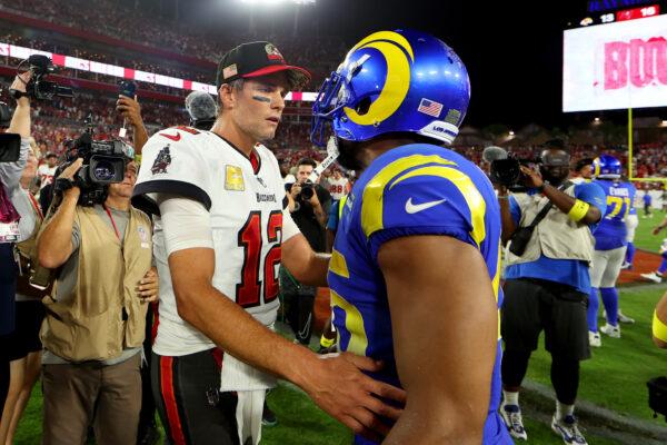 Tom Brady (12) of the Tampa Bay Buccaneers and Bobby Wagner (45) of the Los Angeles Rams meet at midfield after the Buccaneers beat the Rams at Raymond James Stadium in Tampa, Flor., on Nov. 6, 2022. (Mike Ehrmann/Getty Images)