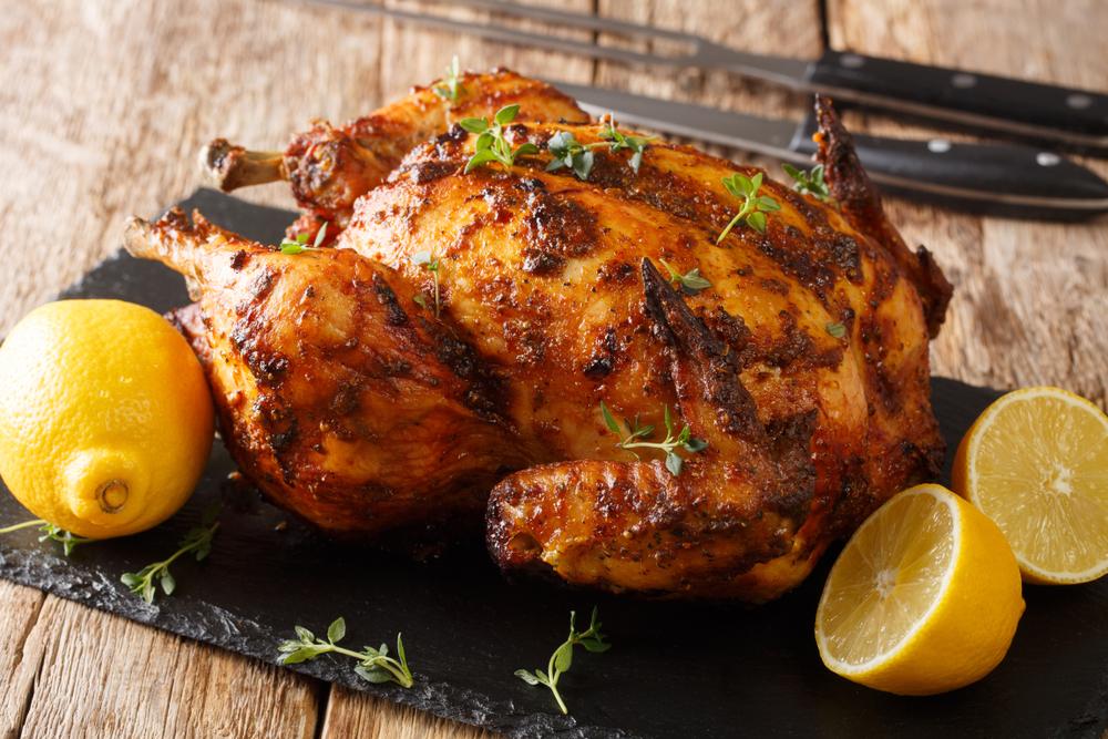 You may find that a rotisserie chicken from your local grocery or a roasted pork loin works just fine as a centerpiece. (Sergii Koval/Shutterstock)