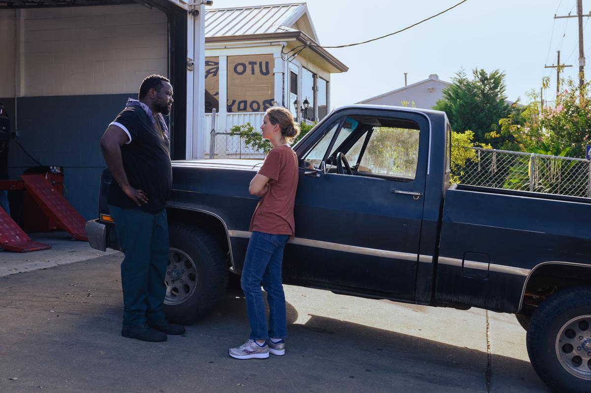 Mechanic James (Brian Tyree Henry) and Army vet Lynsey (Jennifer Lawrence) discussing repairs necessary for her mother's truck, in "Causeway." (A24)