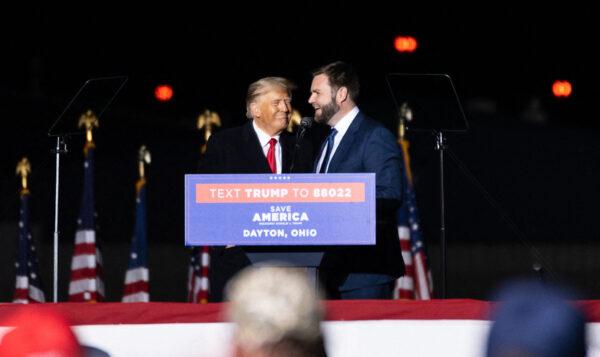 Former U.S. President Donald Trump welcomes Republican U.S. Senate candidate, J.D. Vance on stage during a campaign rally, on the eve of the U.S. midterm elections, in Vandalia, Ohio, on Nov. 7, 2022. (Megan Jelinger/AFP via Getty Images)