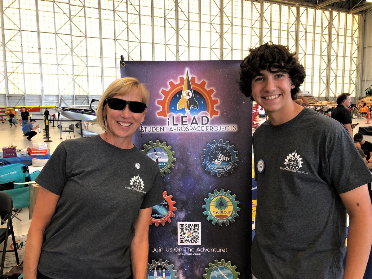 iLEAD Director Kathleen Fredette and student Carter Sand enjoy a STEAM event at an air show at Edwards Air Force Base, where more than 1,200 students experienced hands-on learning with aerospace experts. Carter Sand and Grace Stumpf were accepted to have their class experiment flown to the International Space Station. (Linda KC Reynolds)