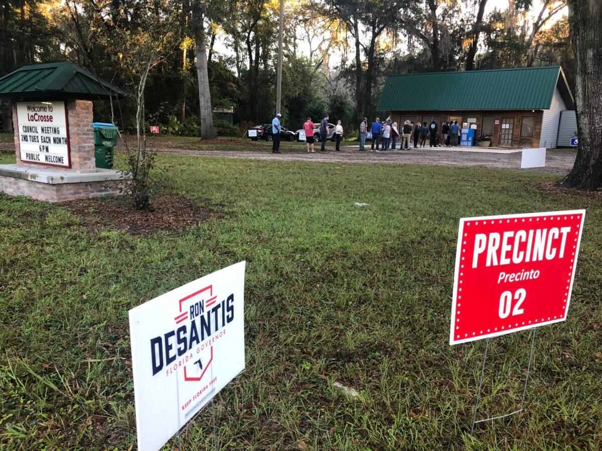 Voters in the rural North Florida town of LaCrosse—with a population of about 300—line up outside the town hall to cast ballots just after polls open on Nov. 8, 2022. (Nanette Holt/The Epoch Times)