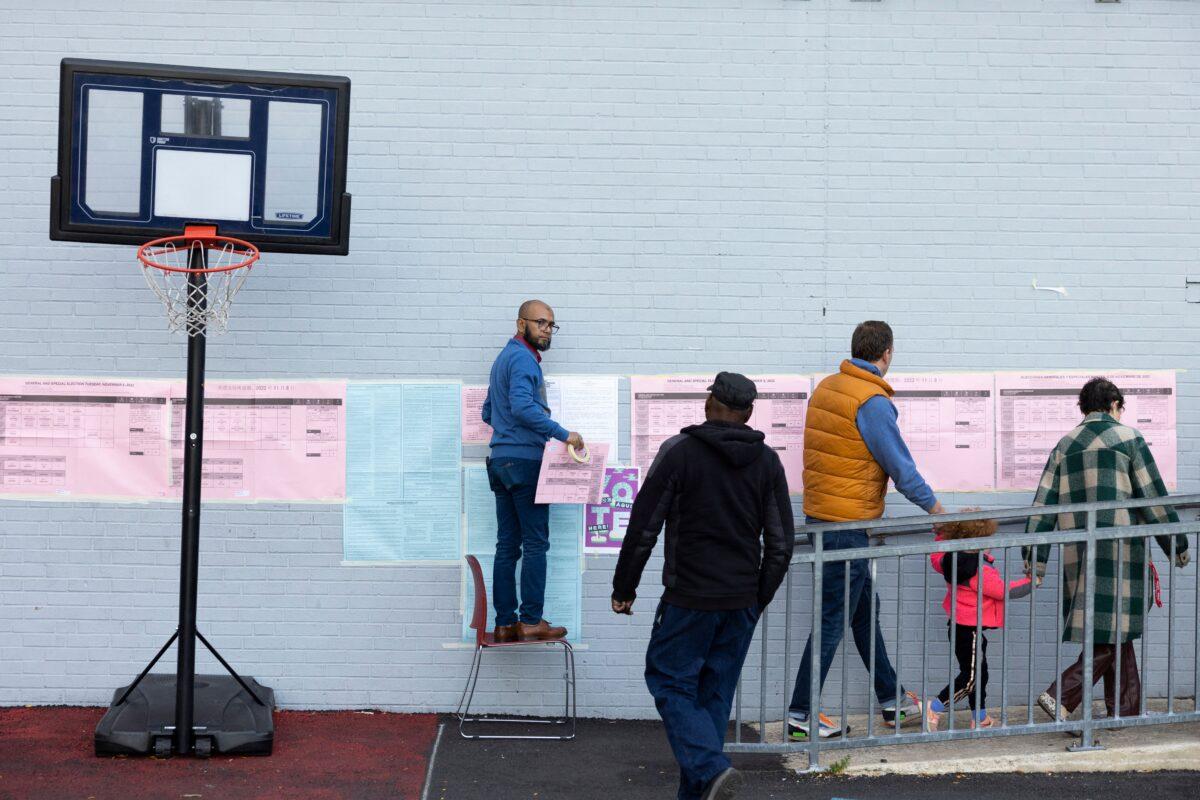 Voters arrive to cast ballots in the midterm election at a polling place in a school in Philadelphia on Nov. 8, 2022. (Ryan Collerd/AFP via Getty Images)