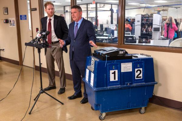 Stephen Richer, the recorder (L) and Bill Gates (R), Chairman of the Maricopa Board of Supervisors, speak at the Maricopa County Tabulation and Election Center in Phoenix, Arizona, on Nov. 8, 2022. (John Moore/Getty Images)