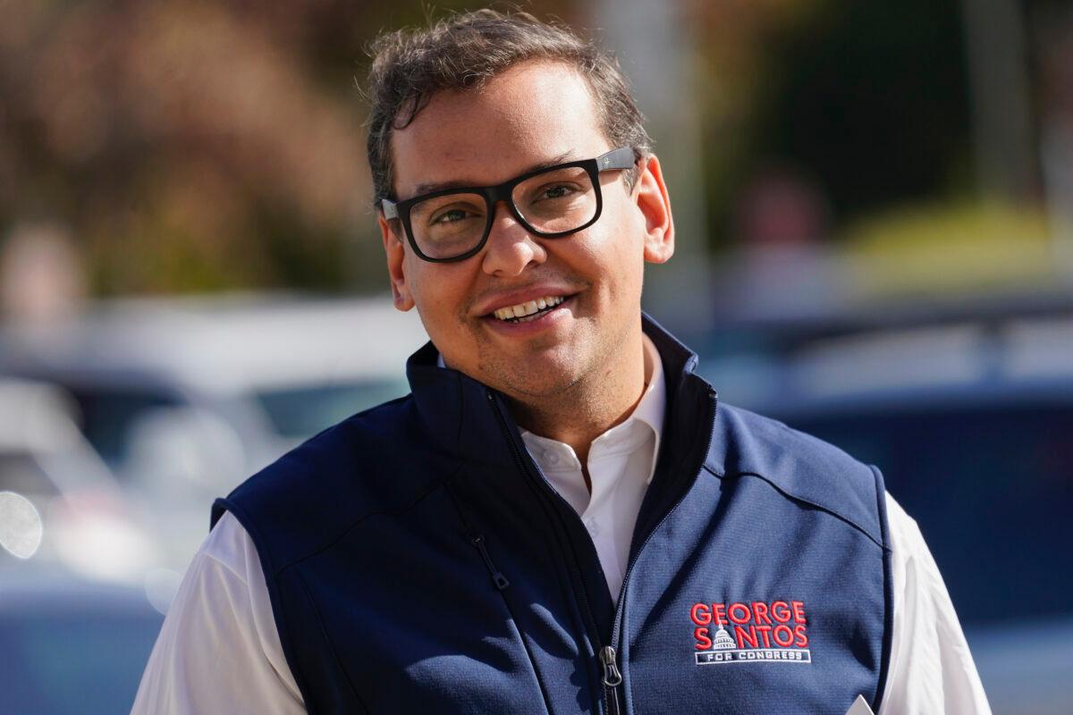 Republican candidate for New York's 3rd Congressional District George Santos campaigns outside a Stop and Shop store, Saturday, in Glen Cove, N.Y., on Nov. 5, 2022. (AP Photo/Mary Altaffer)