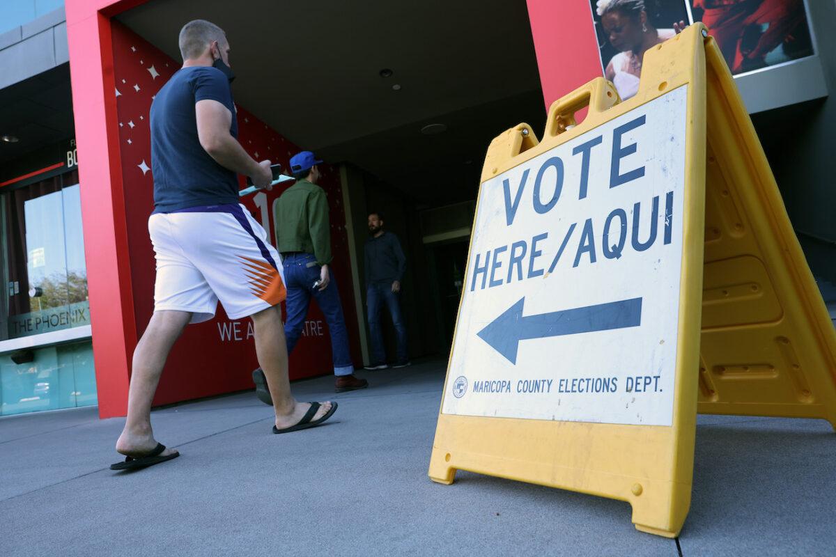 Voters arrive to cast their ballots at the Phoenix Art Museum in Phoenix, Ariz., on Nov. 08, 2022. (Kevin Dietsch/Getty Images)