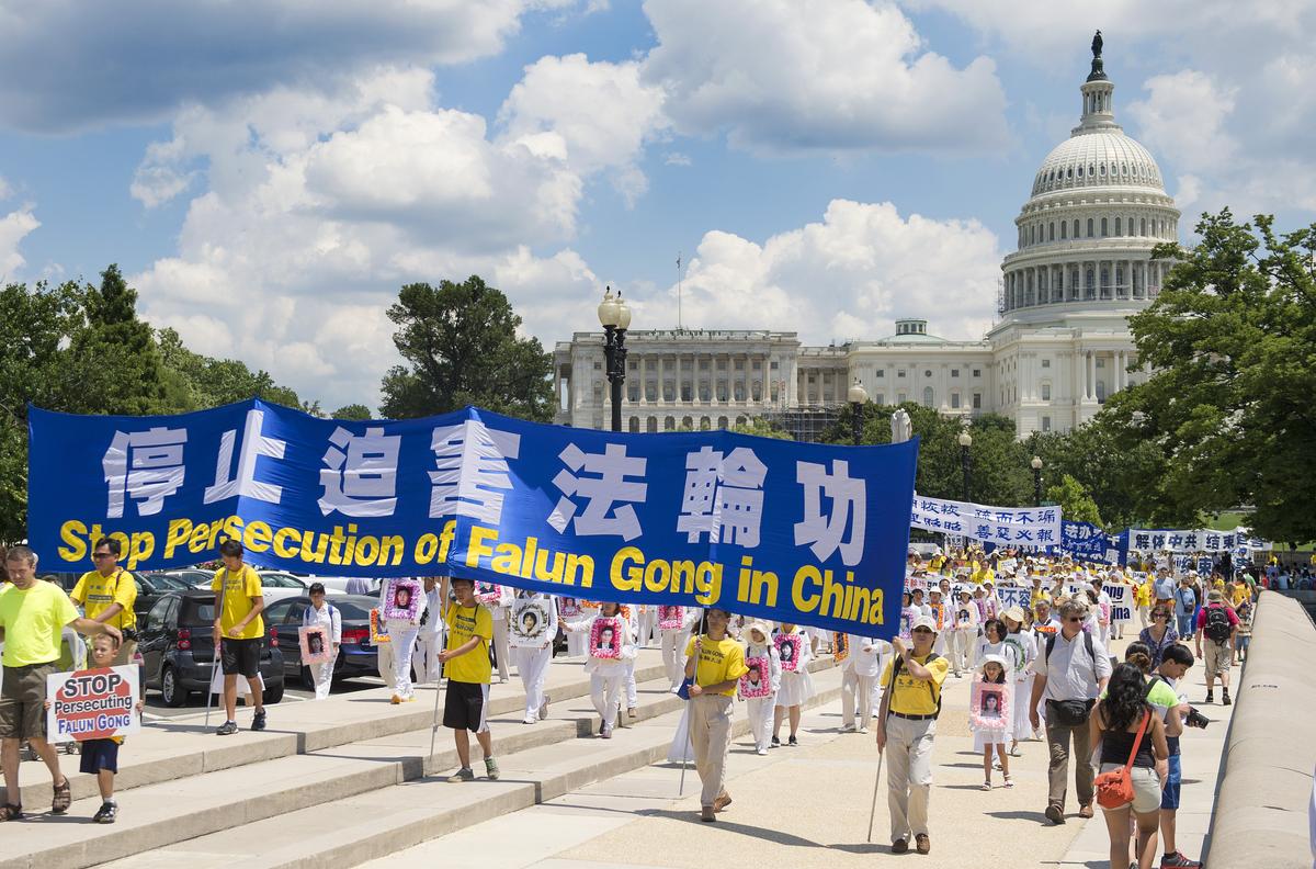 Falun Gong practitioners hold a parade on Capitol Hill in Washington, July 17, 2014. (Jim Watson/AFP via Getty Images)