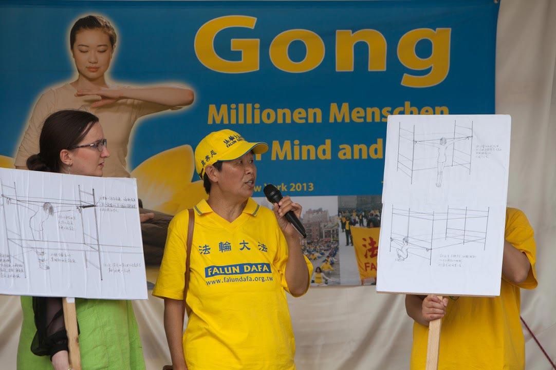 Xu Hui speaks about her persecution at a rally at Potsdamer Platz in central Berlin on July 13, 2016. (Courtesy of Minghui.org)
