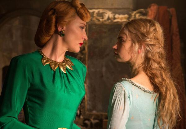 The wicked stepmother (Cate Blanchett, L) gives orders to Cinderella (Lily James) in "Cinderella." (MovieStillsDB)