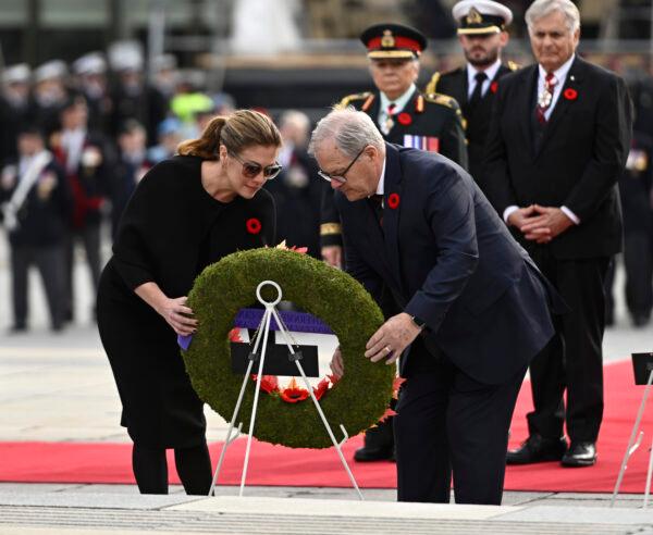 Sophie Gregoire Trudeau, wife of Prime Minister Justin Trudeau, and Minister of Veterans Affairs Lawrence MacAulay place a wreath during the National Remembrance Day Ceremony at the National War Memorial in Ottawa on Nov. 11, 2022. (The Canadian Press/Justin Tang)