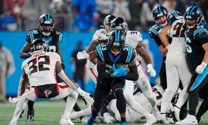 Foreman Leads Panthers Past Rival Falcons in Rain, 25–15