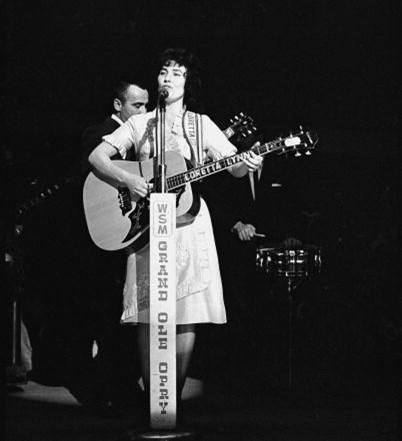 Loretta Lynn performed on stage at the Grand Ole Opry in Nashville, Tenn., in the early 1960s. (Graphic House/Getty Images)