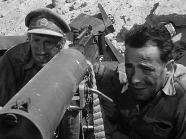 Capt. Jason Halliday (Richard Aherne, L) and Sgt. Joe Gunn (Humphrey Bogart), in “Sahara.” (Columbia Pictures)