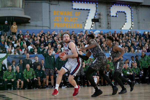 Gonzaga forward Drew Timme, left, drives to the basked at Michigan State center Mady Sissoko defends during the first half of the Carrier Classic NCAA college basketball game aboard the USS Abraham Lincoln, in Coronado, Calif., on Nov. 11, 2022. (Gregory Bull/AP Photo)
