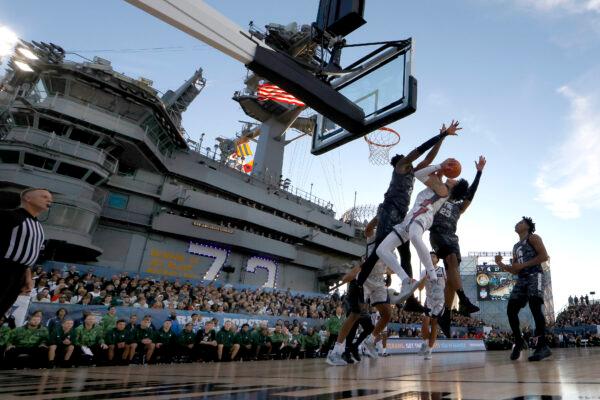 Malik Hall (25) and Mady Sissoko #22 of the Michigan State Spartans defend against Julian Strawther (0) of the Gonzaga Bulldogs during the first half of the Armed Forces Classic aboard the USS Abraham Lincoln in San Diego, on Nov. 11, 2022. (Sean M. Haffey/Getty Images)