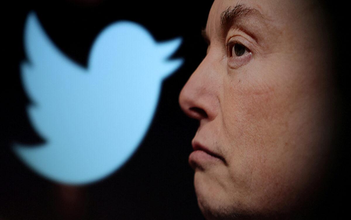 Twitter logo and a photo of Elon Musk are displayed through a magnifier in this illustration taken on Oct. 27, 2022. (Dado Ruvic/Reuters)