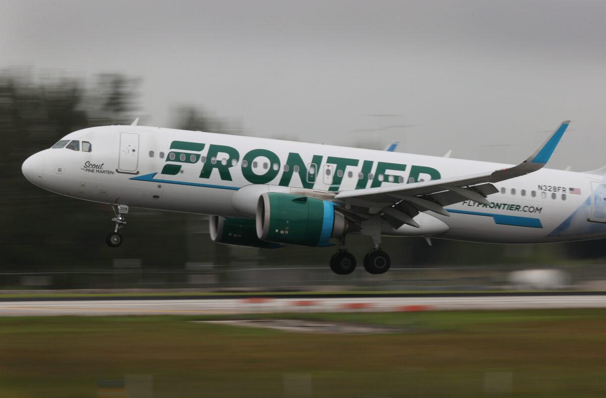 A Frontier Airlines plane lands at the Miami International Airport in Miami on June 16, 2021. (Joe Raedle/Getty Images)