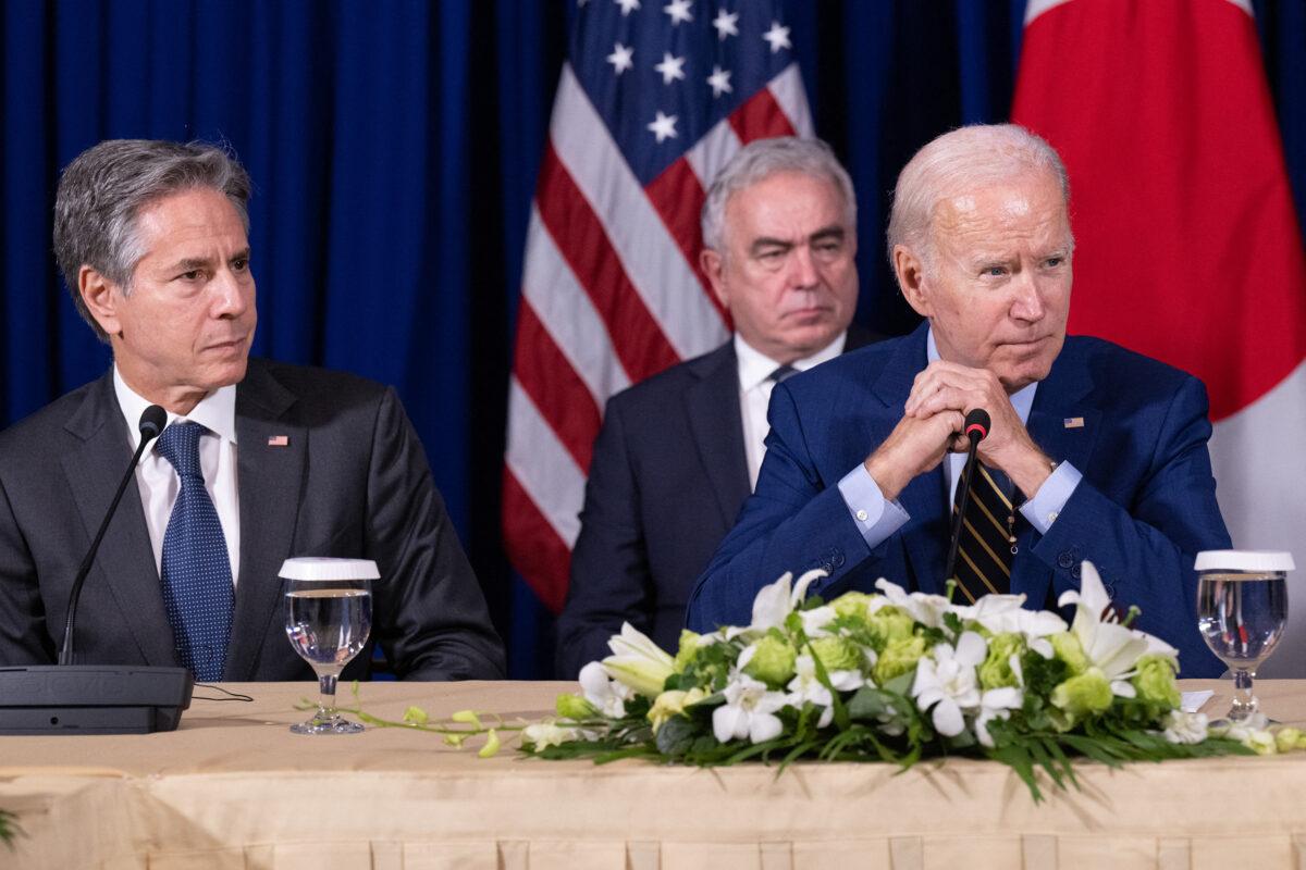U.S. President Joe Biden (R) sits next to U.S. Secretary of State Antony Blinken (L) during a trilateral meeting with Japanese Prime Minister Fumio Kishida and South Korean President Yoon Suk-yeol on the sidelines of the East Asia Summit during the 40th and 41st Association of Southeast Asian Nations (ASEAN) Summits in Phnom Penh, Cambodia, on Nov. 13, 2022. (Saul Loeb/AFP via Getty Images)