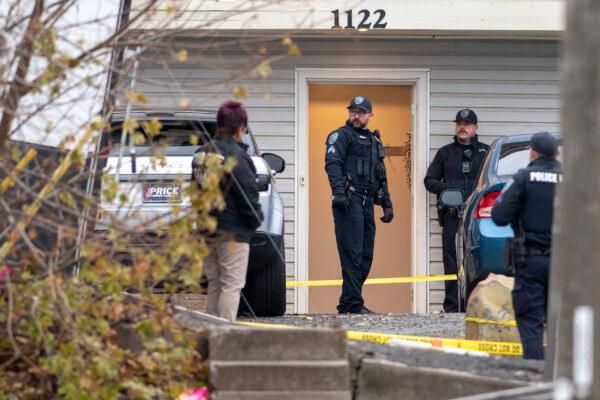 Officers investigate a homicide at an apartment complex south of the University of Idaho campus on Nov. 13, 2022. (Zach Wilkinson/The Moscow-Pullman Daily News via AP)