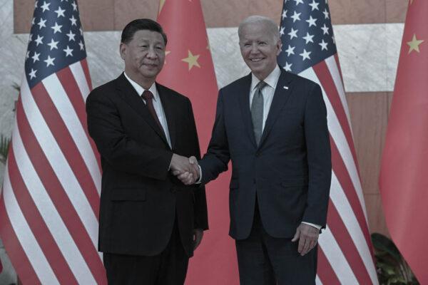 U.S. President Joe Biden (R) and China's leader Xi Jinping (L) shakes hands as they meet on the sidelines of the G-20 Summit in Nusa Dua on the Indonesian resort island of Bali on Nov. 14, 2022. (Saul Loeb/AFP via Getty Images)