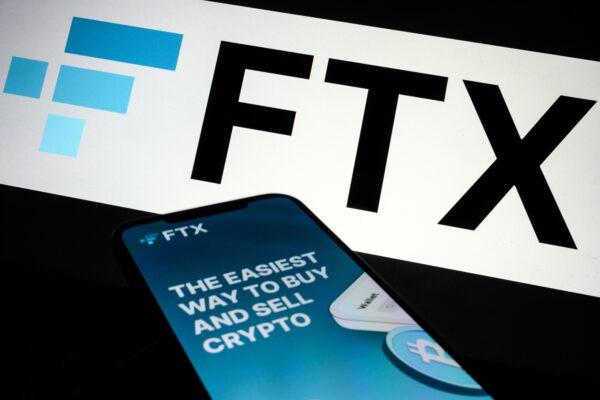 The FTX logo and mobile app adverts are displayed on screens in London on Nov. 10, 2022. (Leon Neal/Getty Images)