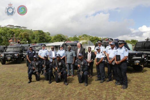 Solomon Islands Prime Minister Manasseh Sogavare standing next to Australian High Commissioner Lachlan Strahan along with members of the Royal Solomon Islands Police Force and Australian Defence Force during a gifting ceremony in Honiara, Solomon Islands, on Nov. 2, 2022. (Courtesy of the Australian Federal Police)