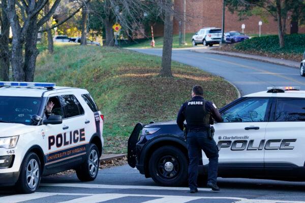 Charlottesville police secure a crime scene of an overnight shooting at the University of Virginia in Charlottesville, Va, on Nov. 14, 2022, (Steve Helber/AP Photo)