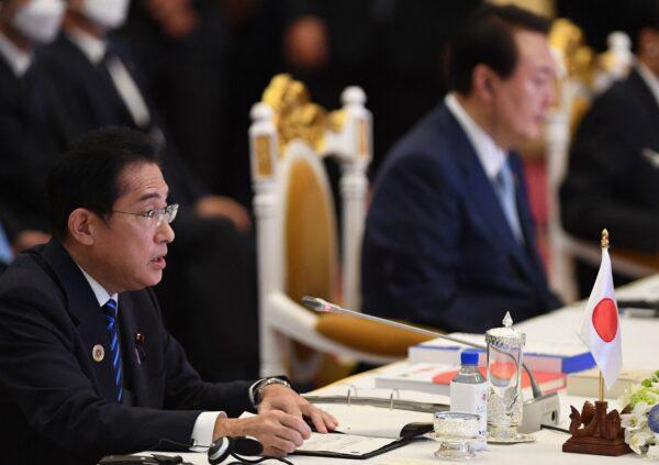 Japan's Prime Minister Fumio Kishida (L) and South Korea's President Yoon Suk-yeol (R) take part in the ASEAN-Plus Three Summit in Phnom Penh on Nov. 12, 2022. (Tang Chhin Sothy/AFP via Getty Images)