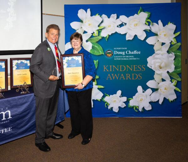 Orange County Board of Supervisors Chairman Doug Chaffee awards Mary Shandrow at the Fourth District Kindness Awards ceremony in Fullerton, Calif., on Nov. 13, 2022. (Courtesy of the Office of Chairman Doug Chaffee)