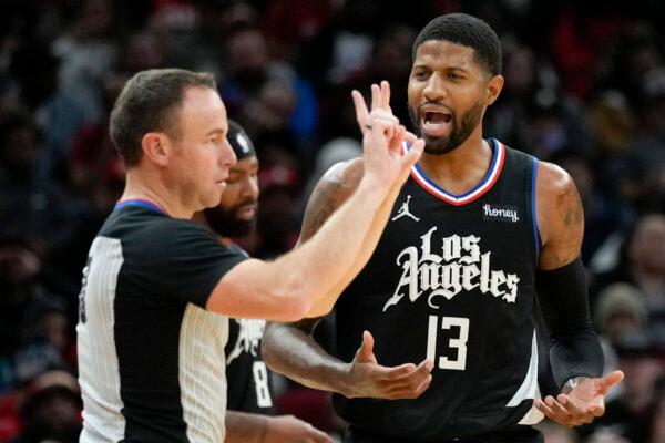 Los Angeles Clippers guard Paul George (13) argues call with referee Josh Tiven during the second half of an NBA basketball game against the Houston Rockets, in Houston, on Nov. 14, 2022. (Eric Christian Smith/AP Photo)