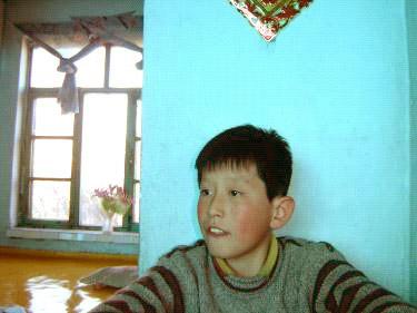 Sheng Wei, 13, after he was beaten by the Chinese police. (Courtesy of Minghui.org)