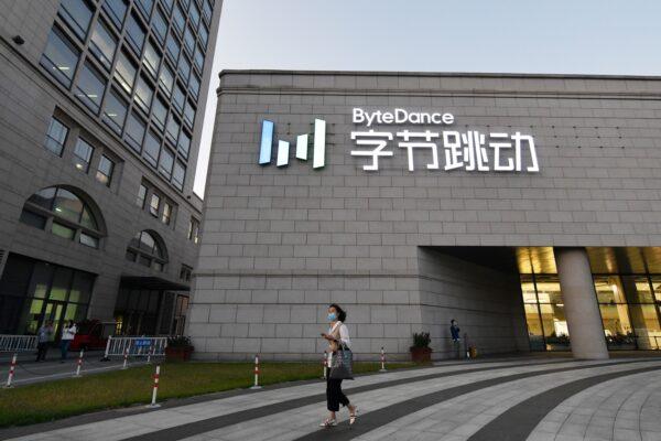 A woman walks past the headquarters of ByteDance, parent company of video-sharing app TikTok, in Beijing, on Sept. 16, 2020. (Greg Baker/AFP via Getty Images)