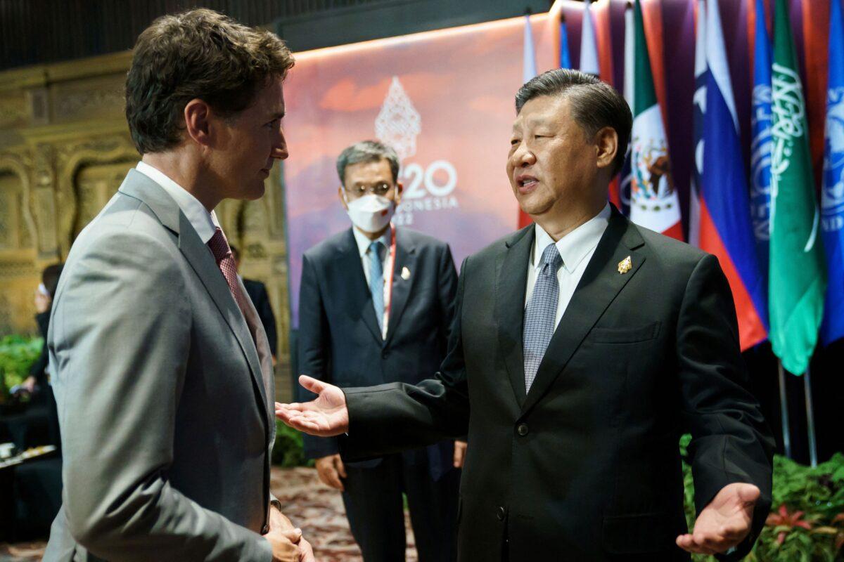 Chinese leader Xi Jinping speaks with Canadian Prime Minister Justin Trudeau on the sidelines of the G20 summit in Bali, Indonesia, on Nov. 16, 2022. (Adam Scotti/Prime Minister's Office/Handout via Reuters)