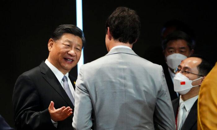 Chinese leader Xi Jinping talks with Canadian Prime Minister Justin Trudeau after taking part in the closing session at the G-20 Leaders Summit in Bali, Indonesia, on Nov. 16, 2022. (The Canadian Press/Sean Kilpatrick)