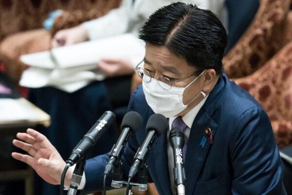 Japan's Minister of Health, Labour, and Welfare Katsunobu Kato wears a face mask while speaking during a budget committee meeting at the lower house of Parliament in Tokyo on April 28, 2020. (Tomohiro Ohsumi/Getty Images)