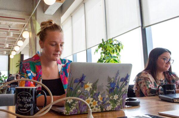 Kirsty Hall, a digital nomad from Scotland who lives in Mexico but works remotely with a start-up in San Francisco, in the U.S., works on her laptop at WeWork, a coworking and office space in Mexico City, on Sept. 13, 2022. (Claudio Cruz/AFP via Getty Images)